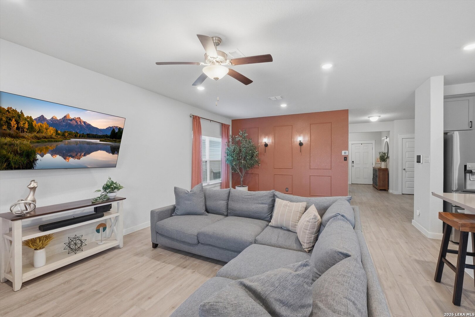 10776 Rosalina Loop Converse, TX 78109 - Photo 8 of 31 a living room with furniture and a flat screen tv