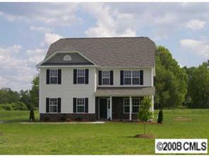 2023 Ruben Road Monroe, NC 28112 - Photo 1 of 8 a front view of a house with a garden