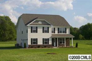 2023 Ruben Road Monroe, NC 28112 - Photo 2 of 8 a front view of a house with a garden