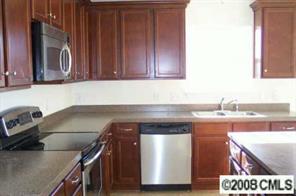 2023 Ruben Road Monroe, NC 28112 - Photo 4 of 8 a kitchen with a sink cabinets and stainless steel appliances