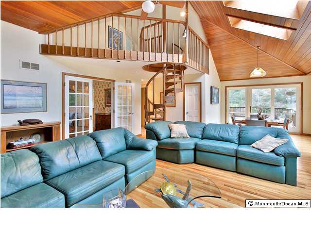 11 Pirates Cove Road Little Silver, NJ 07739 - Photo 2 of 14 a view of living room filled with furniture and a large window