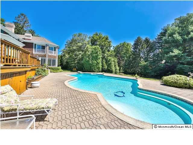11 Pirates Cove Road Little Silver, NJ 07739 - Photo 12 of 14 a view of a swimming pool with a lounge chairs