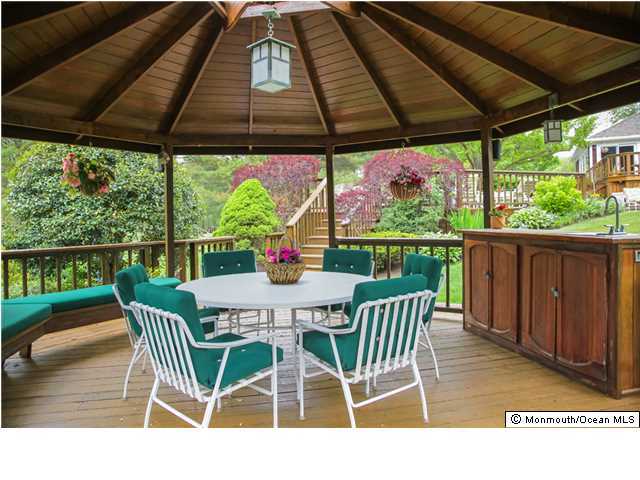 11 Pirates Cove Road Little Silver, NJ 07739 - Photo 13 of 14 a view of a chairs and table in the patio