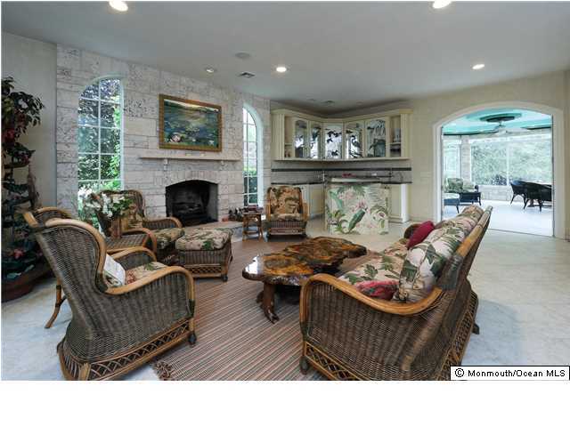 11 Pirates Cove Road Little Silver, NJ 07739 - Photo 3 of 14 a living room with furniture and a fireplace