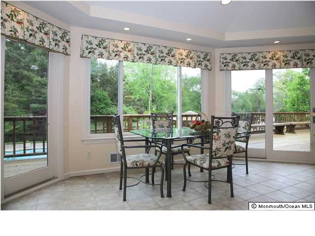 11 Pirates Cove Road Little Silver, NJ 07739 - Photo 5 of 14 a dining room with furniture and a floor to ceiling window