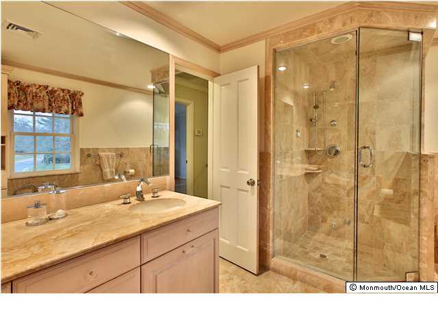 11 Pirates Cove Road Little Silver, NJ 07739 - Photo 9 of 14 a bathroom with a sink and a mirror