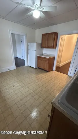 a bathroom with a sink vanity and a mirror