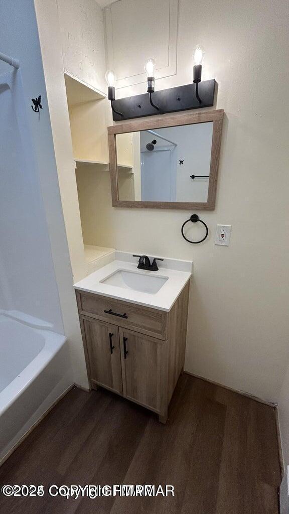 424 Main Street, Unit 7 Stroudsburg, PA 18360 - Photo 14 of 15 a bathroom with a sink vanity and a mirror