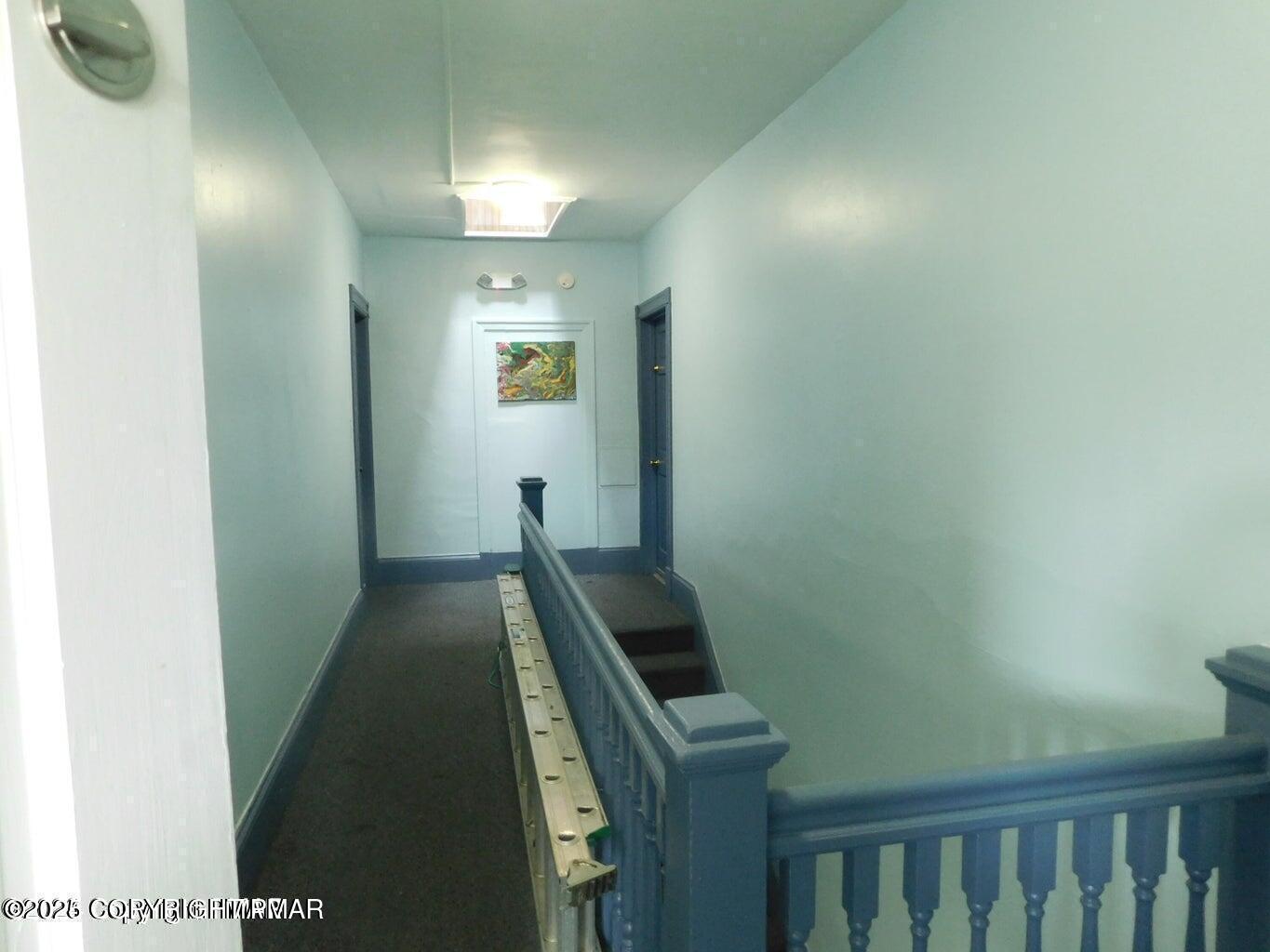 424 Main Street, Unit 7 Stroudsburg, PA 18360 - Photo 3 of 15 a view of a hallway with wooden floor