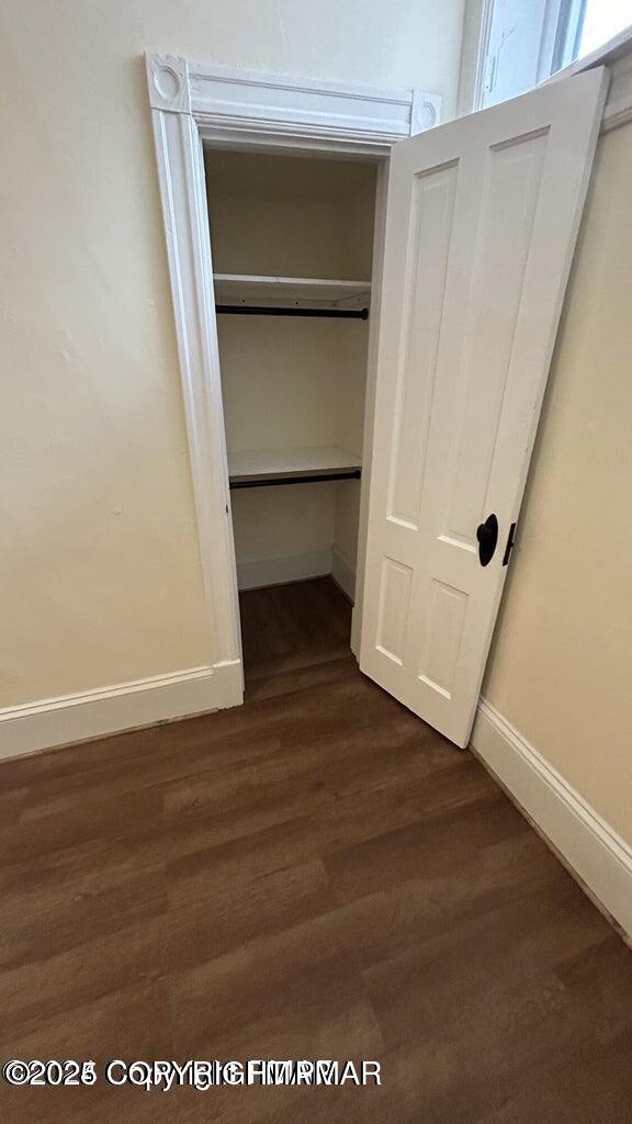 424 Main Street, Unit 7 Stroudsburg, PA 18360 - Photo 8 of 15 a view of an empty room with wooden floor and cabinet
