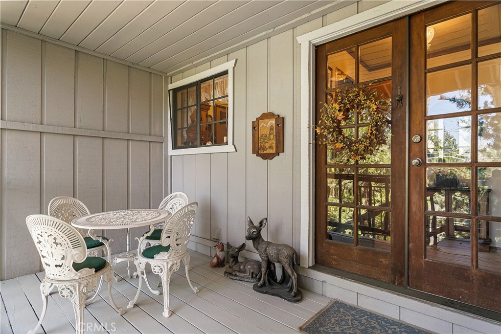 329 Grass Valley Road Lake Arrowhead, CA 92352 - Photo 8 of 31 a dining room with furniture and window