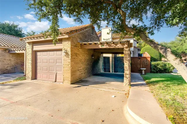 a view of a house with a yard and garage