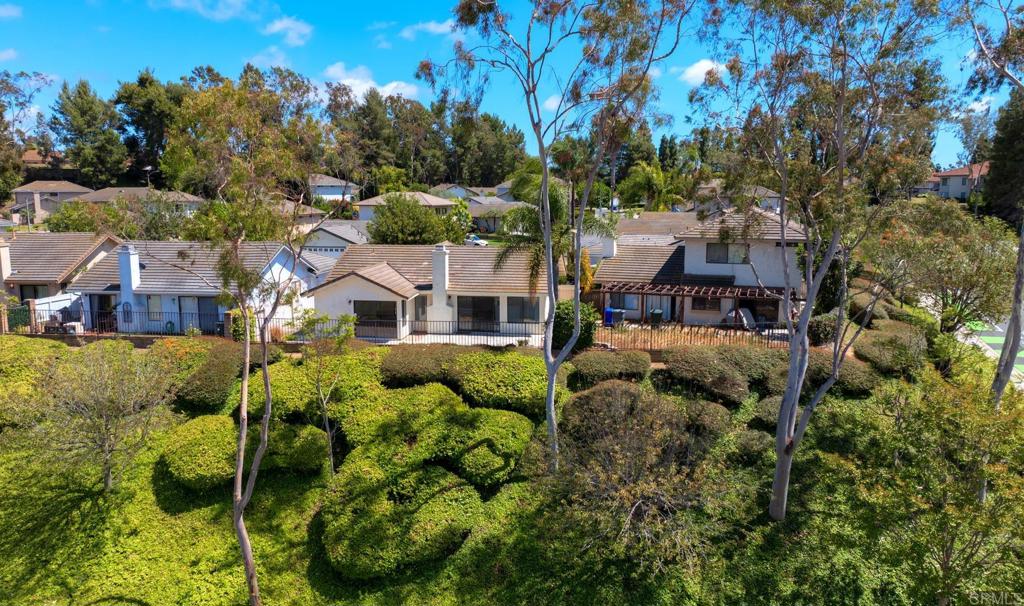 1394 Longfellow Road Vista, CA 92081 - Photo 30 of 50 a aerial view of a house with a yard plants and large tree