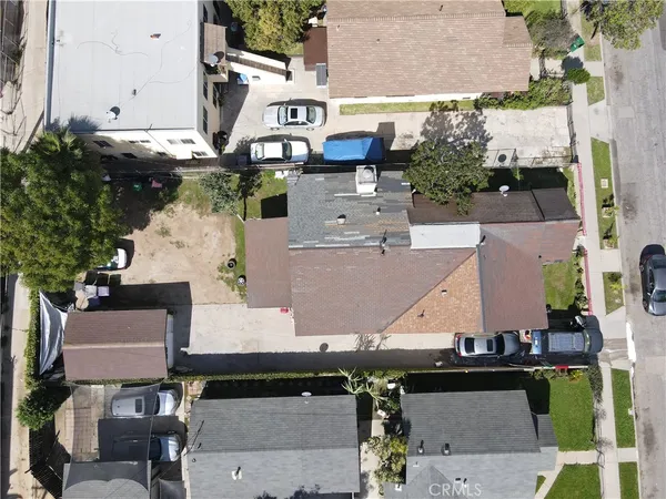 an aerial view of multiple houses with outdoor space