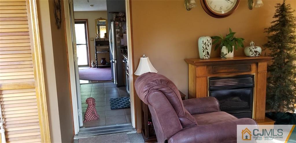 25 Idlewild Road Edison, NJ 08817 - Photo 14 of 27 a living room with furniture and a window