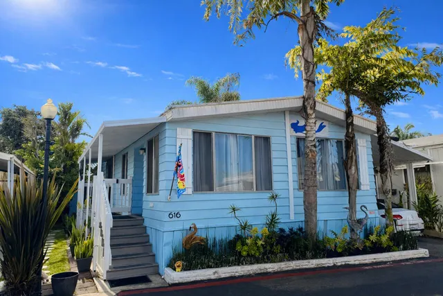 a front view of a house with a small yard