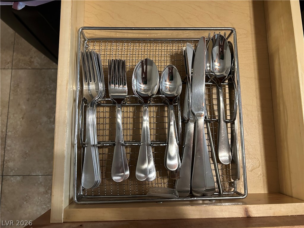 267 Westwind Road Henderson, NV 89074 - Photo 9 of 27 Culinary organization achieved with a sleek, chrome utensil drawer insert.