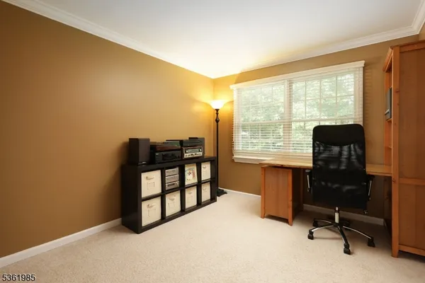 a view of workspace with furniture and a window