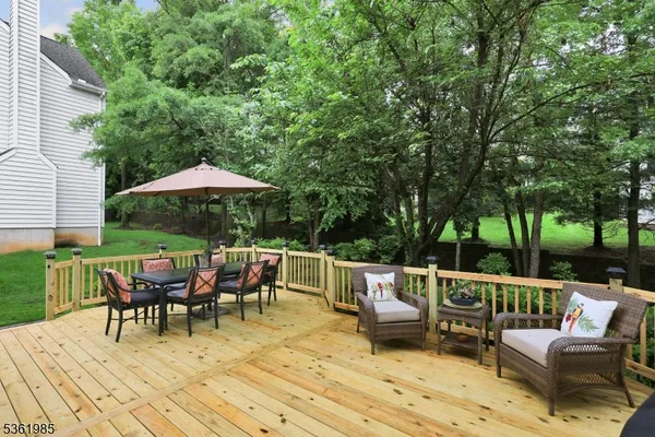 a view of a roof deck with furniture