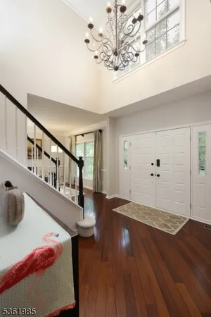 a view of an entryway with wooden floor
