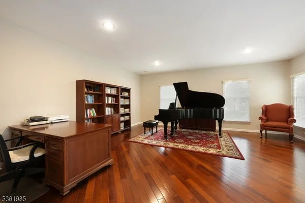 a work room with furniture and wooden floor