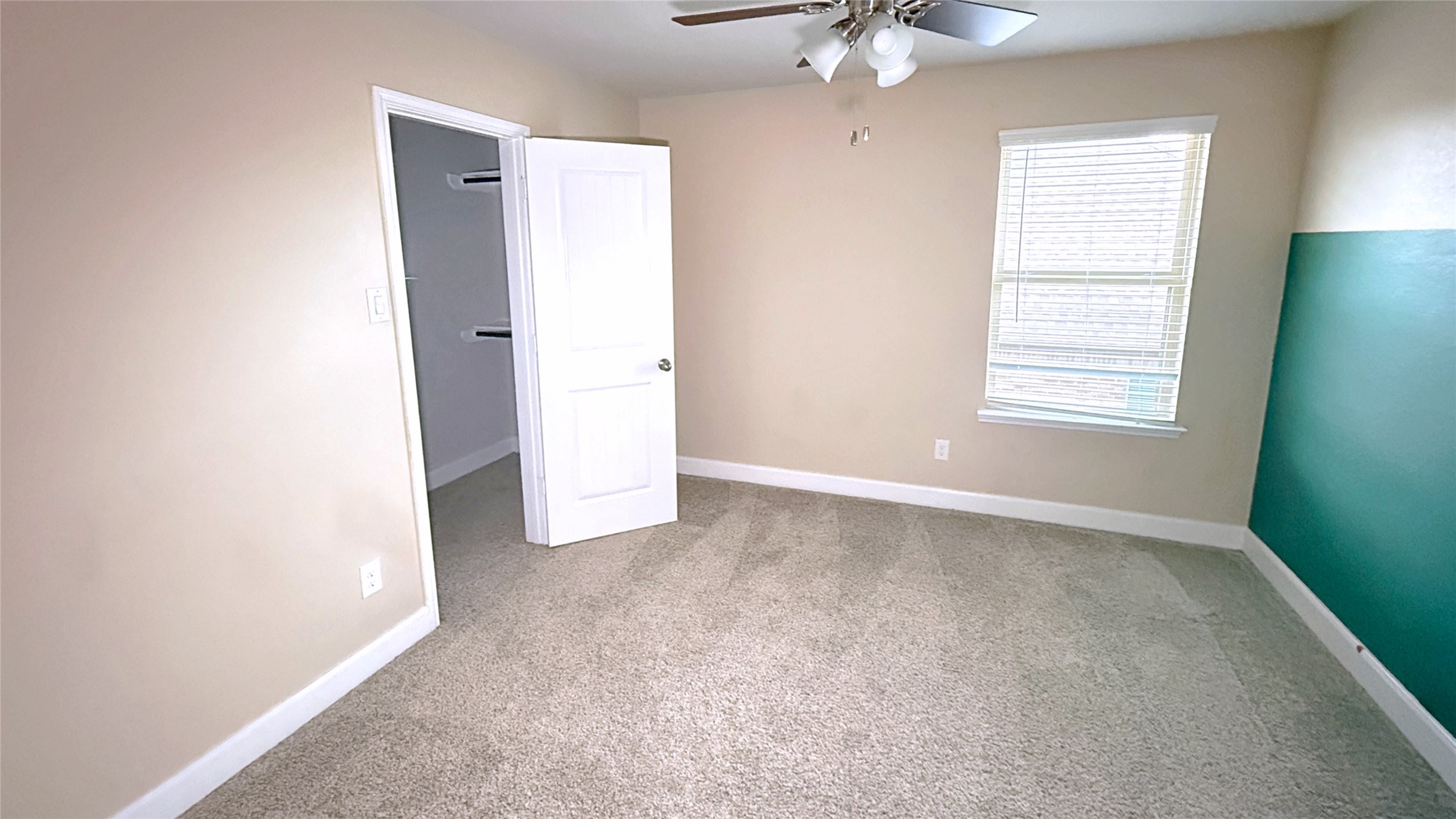 28919 Copper Break Court Katy, TX 77494 - Photo 24 of 31 an empty room with windows and fan