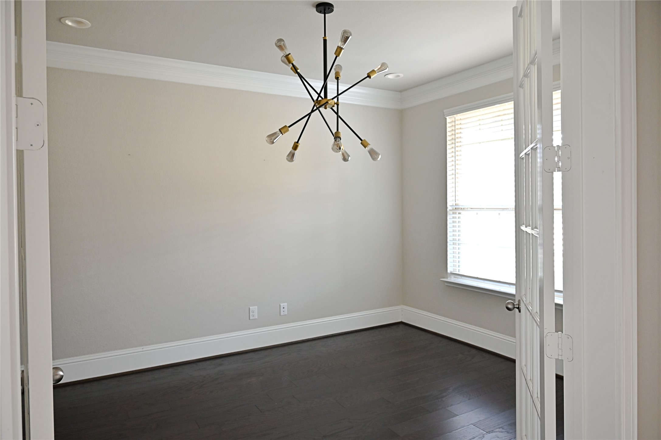28919 Copper Break Court Katy, TX 77494 - Photo 4 of 31 an empty room with wooden floor fan and windows