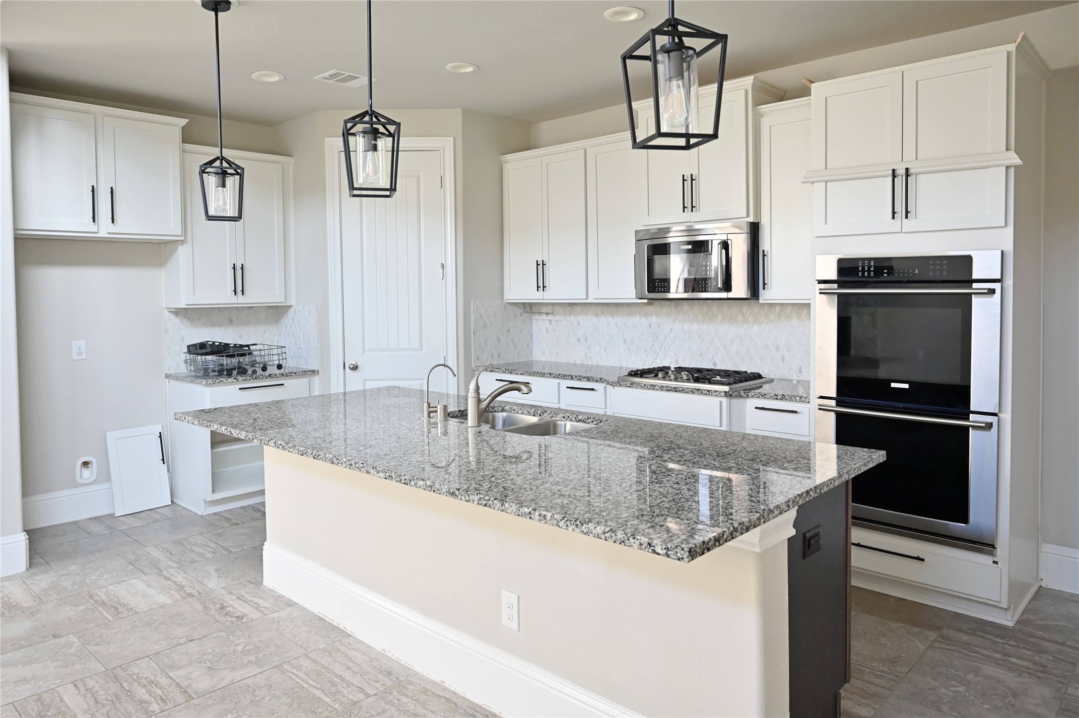 28919 Copper Break Court Katy, TX 77494 - Photo 6 of 31 a kitchen with stainless steel appliances granite countertop a sink a stove and a refrigerator