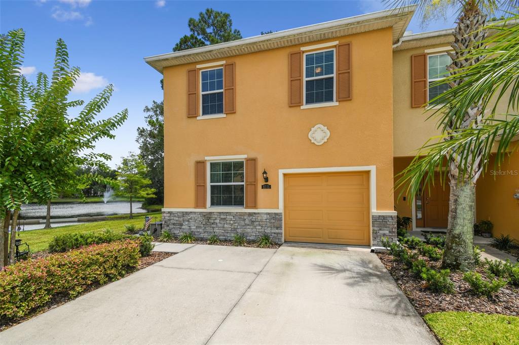 8335 Pine River Road Tampa, FL 33637 - Photo 1 of 1 a front view of a house with a yard and garage