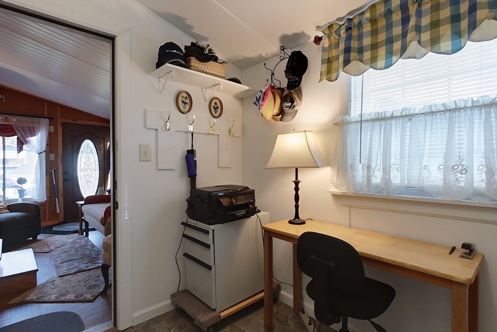 239 Ayer Road, Unit 46 Littleton, MA 01460 - Photo 16 of 28 a living room with furniture and a lamp