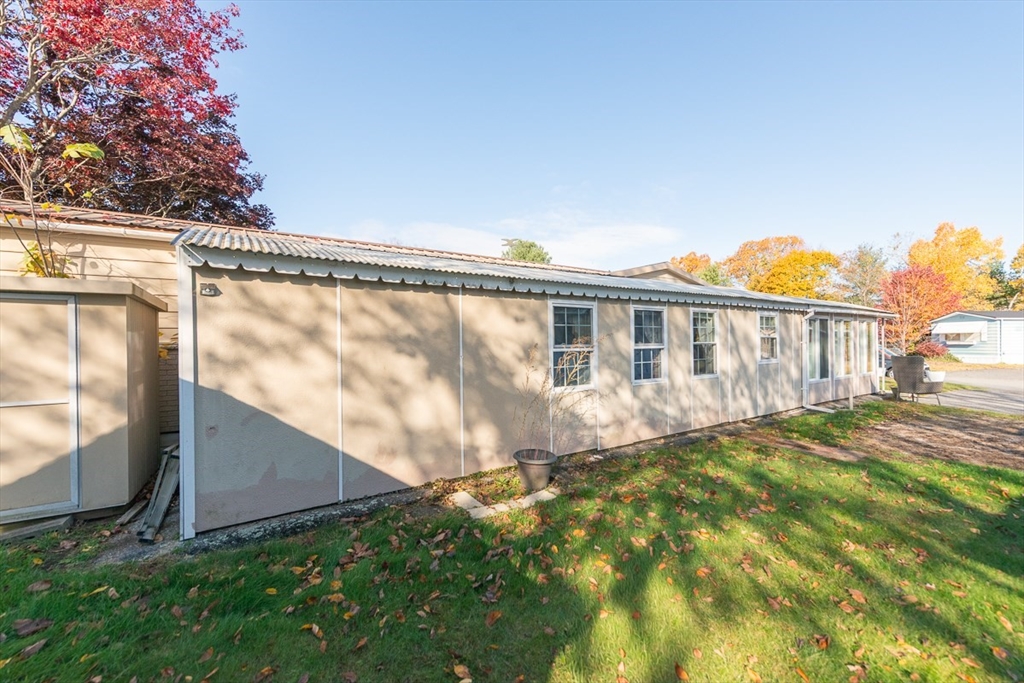 239 Ayer Road, Unit 46 Littleton, MA 01460 - Photo 2 of 28 a view of a house with a backyard