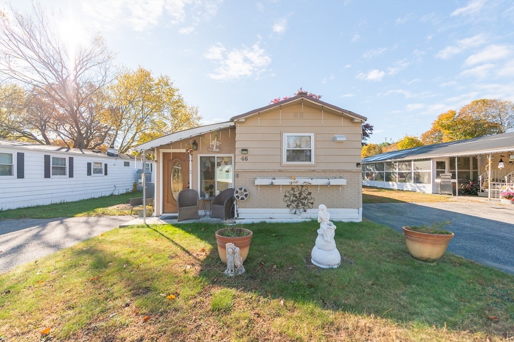 239 Ayer Road, Unit 46 Littleton, MA 01460 - Photo 23 of 28 a front view of house with yard and porch