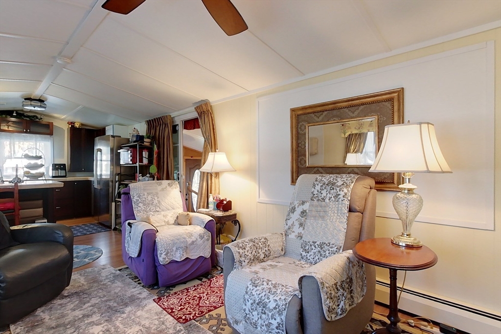 239 Ayer Road, Unit 46 Littleton, MA 01460 - Photo 9 of 28 a living room with furniture and a lamp