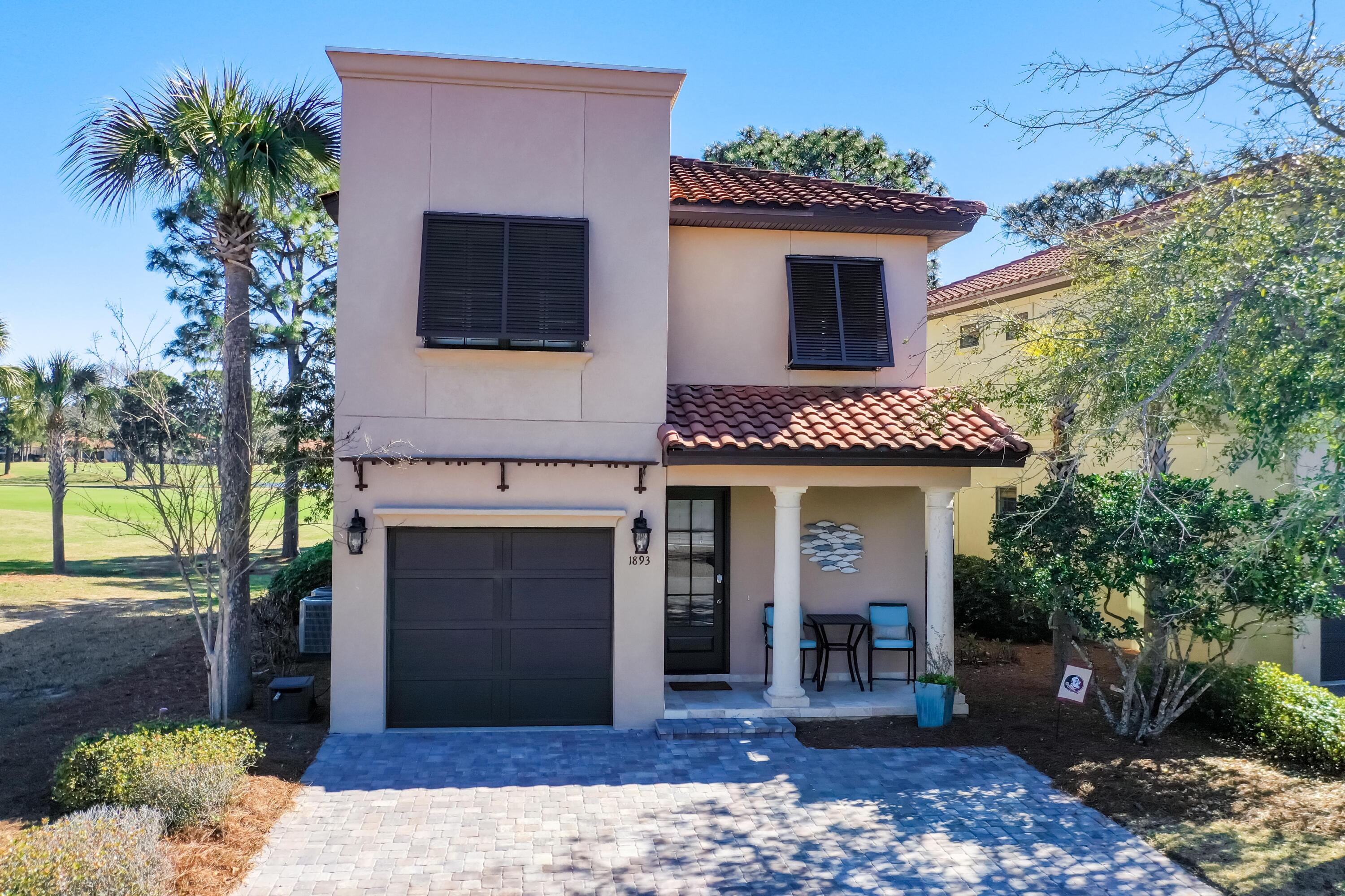 a front view of a house with yard
