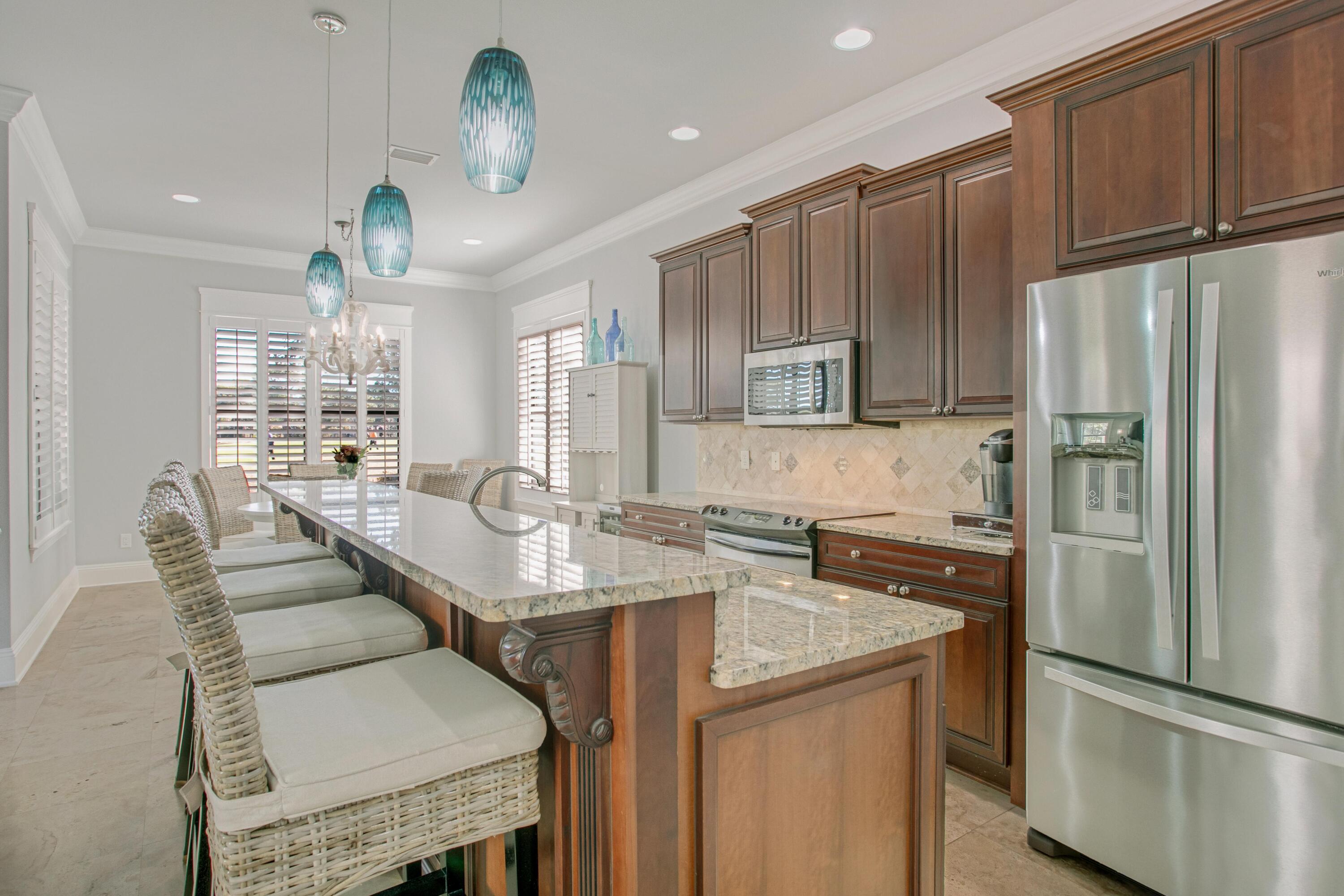 1893 Baytowne Loop Miramar Beach, FL 32550 - Photo 12 of 45 a kitchen with stainless steel appliances granite countertop a sink refrigerator and microwave