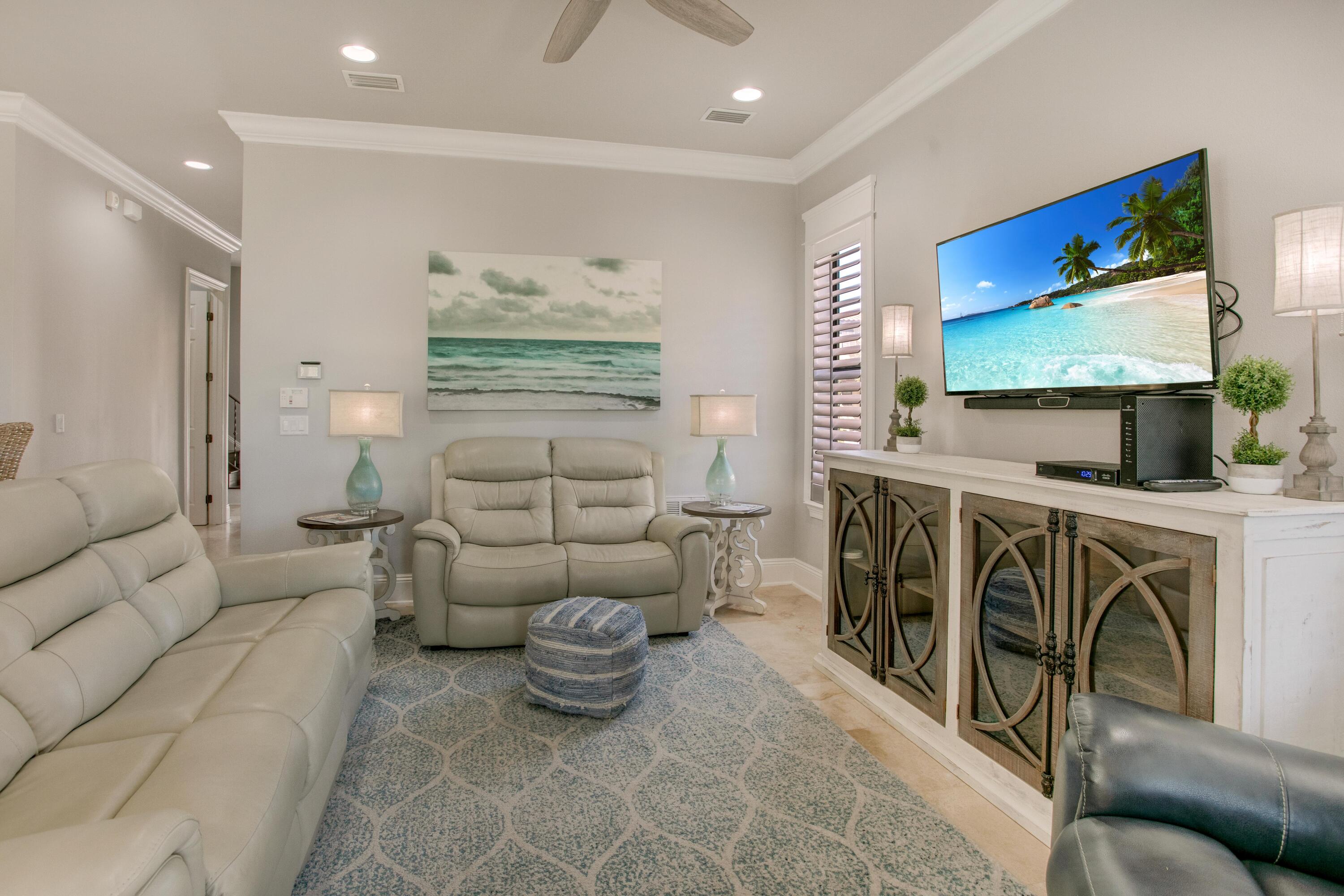 1893 Baytowne Loop Miramar Beach, FL 32550 - Photo 19 of 45 a living room with furniture a fireplace and a flat screen tv