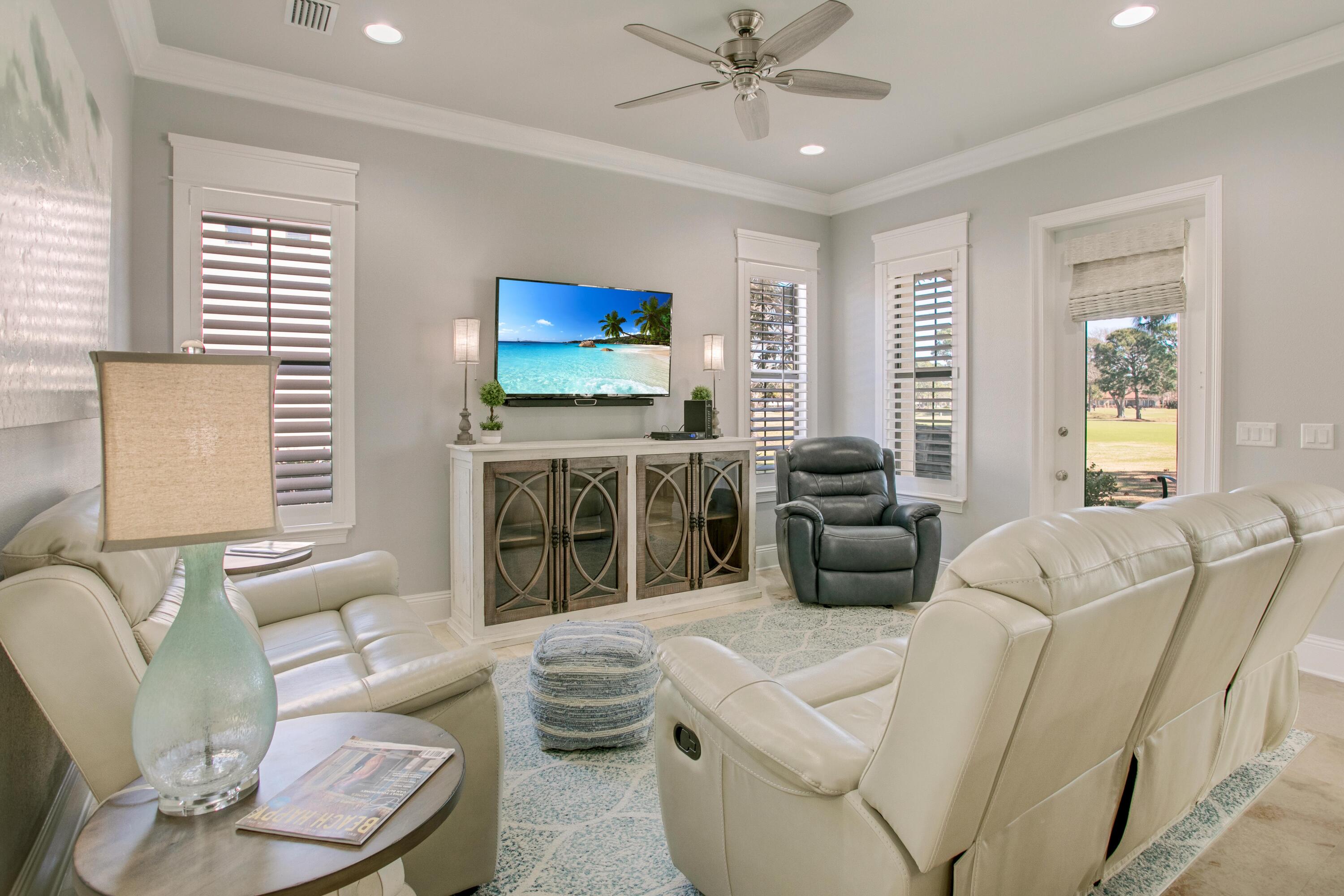 1893 Baytowne Loop Miramar Beach, FL 32550 - Photo 21 of 45 a living room with furniture a fireplace and a flat screen tv