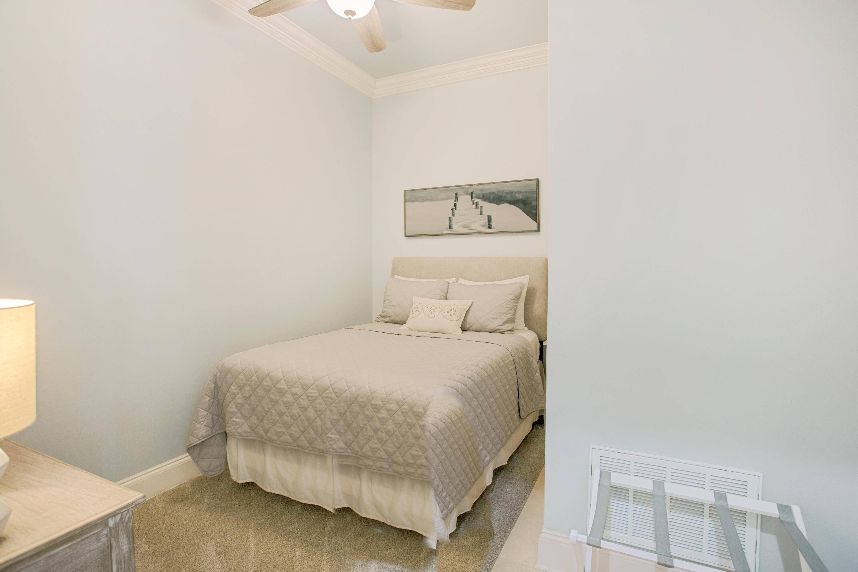 1893 Baytowne Loop Miramar Beach, FL 32550 - Photo 24 of 45 a bedroom with a bed and a window