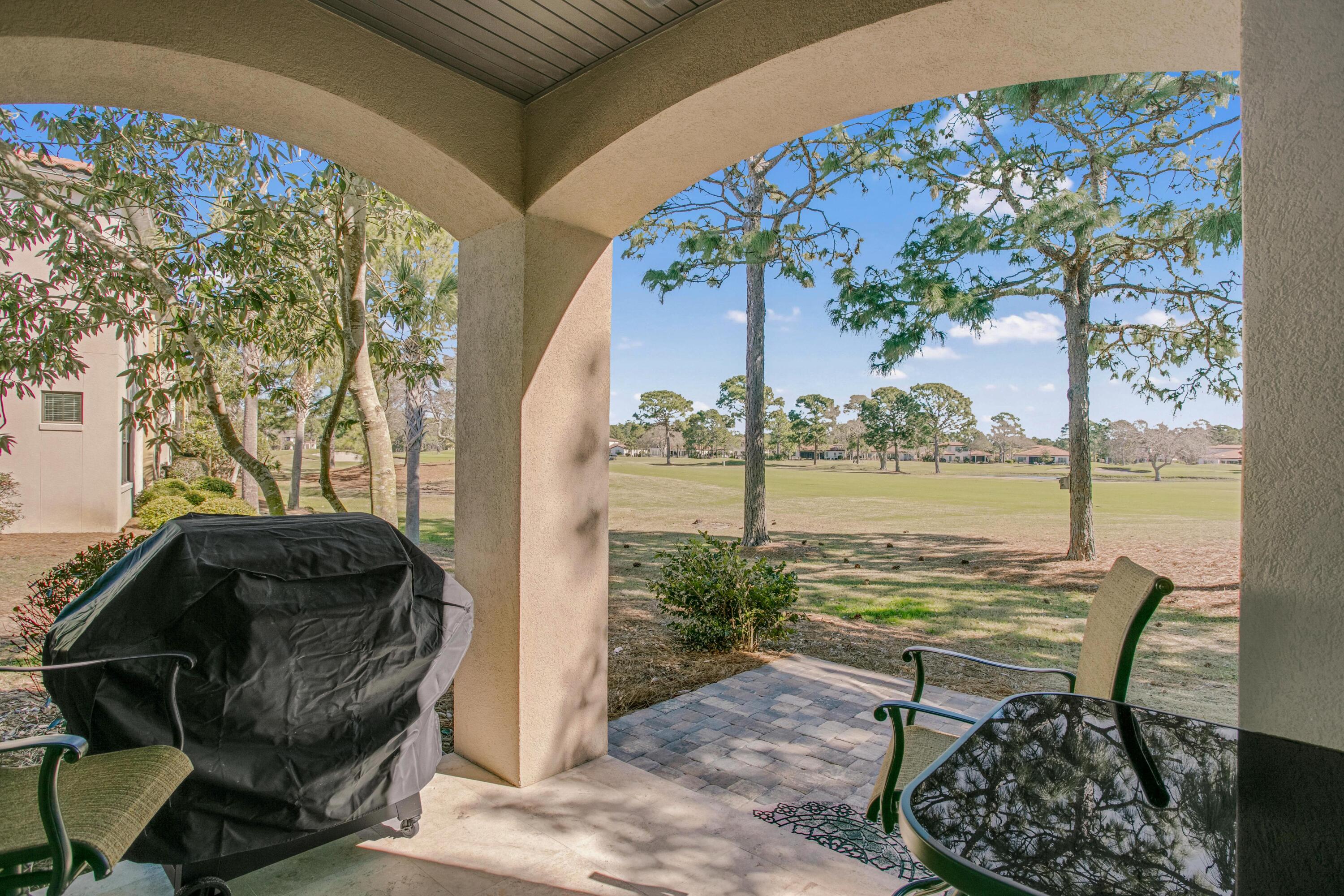 1893 Baytowne Loop Miramar Beach, FL 32550 - Photo 27 of 45 a view of a chairs and table in the patio