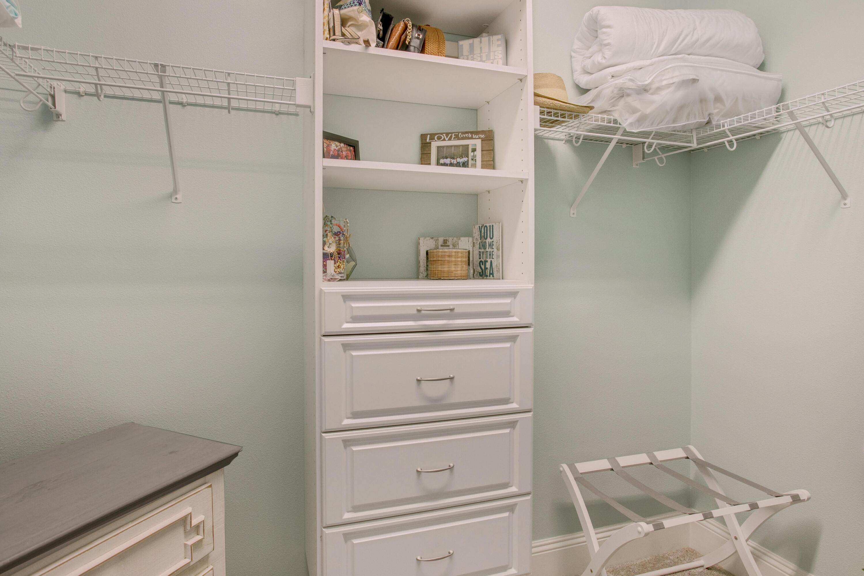 1893 Baytowne Loop Miramar Beach, FL 32550 - Photo 31 of 45 a view of walk in closet with clothes and shoes