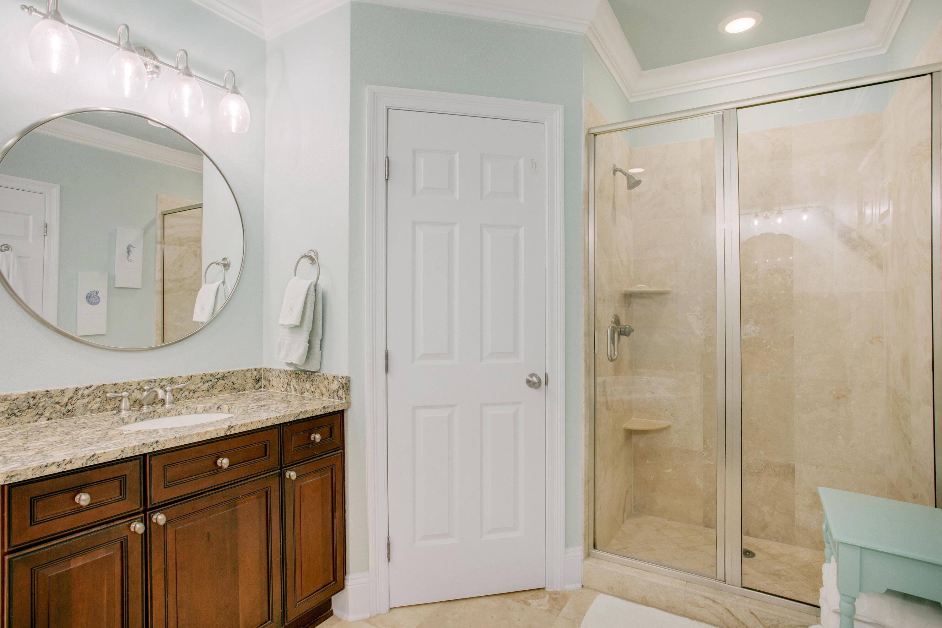 1893 Baytowne Loop Miramar Beach, FL 32550 - Photo 33 of 45 a bathroom with a granite countertop sink mirror and shower