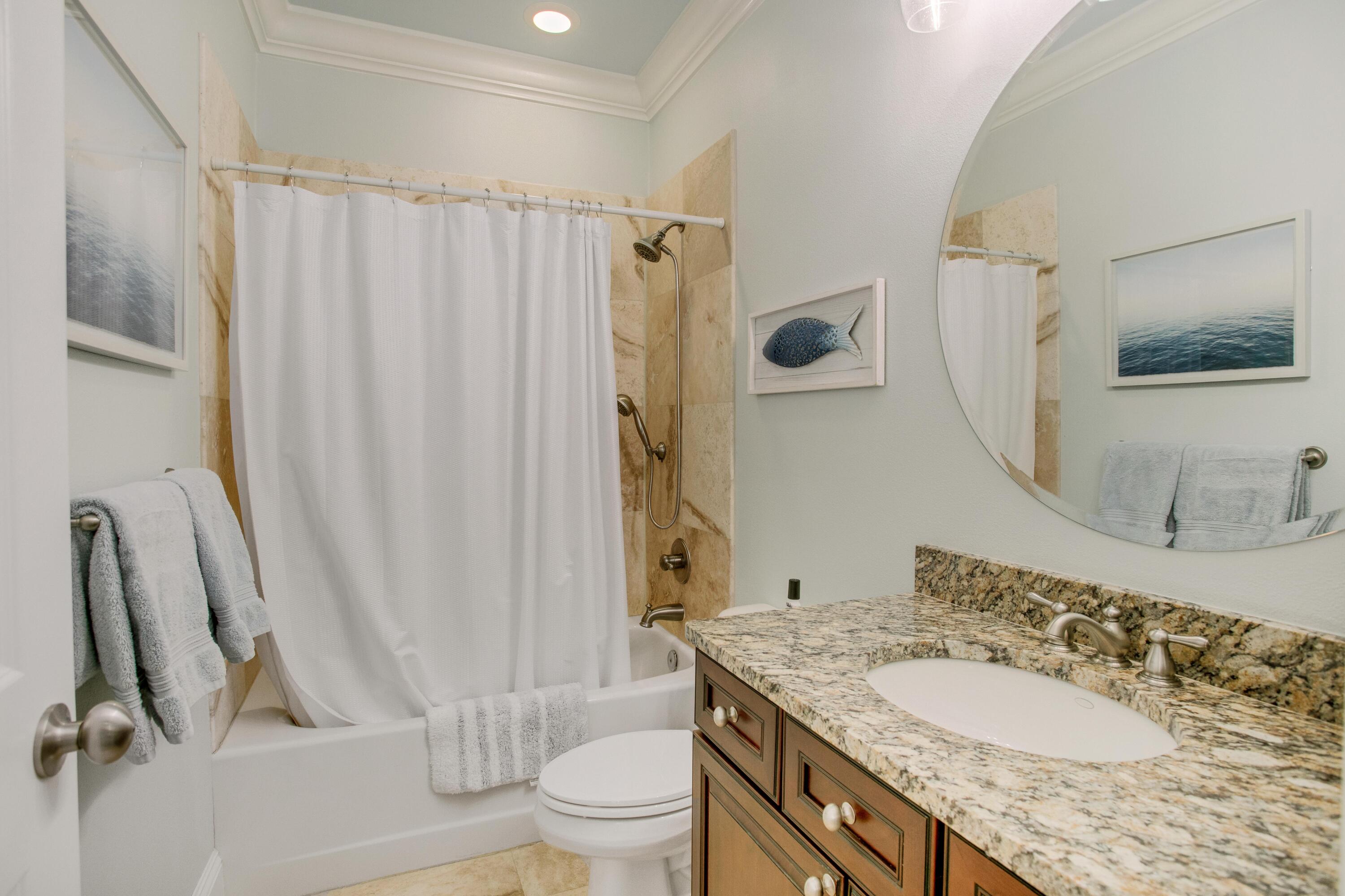 1893 Baytowne Loop Miramar Beach, FL 32550 - Photo 36 of 45 a bathroom with a granite countertop sink toilet and shower