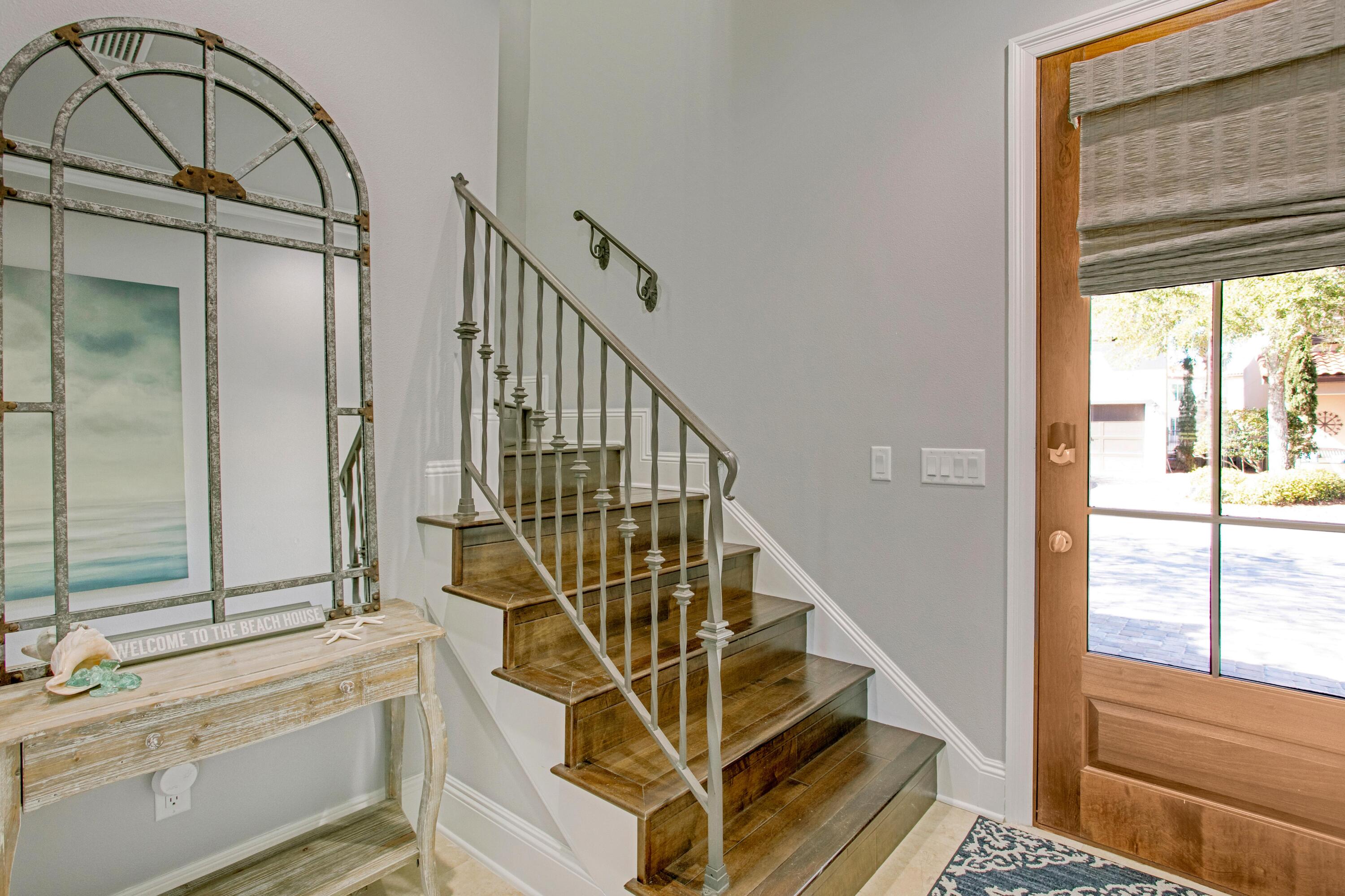 1893 Baytowne Loop Miramar Beach, FL 32550 - Photo 44 of 45 a view of staircase with white walls and windows