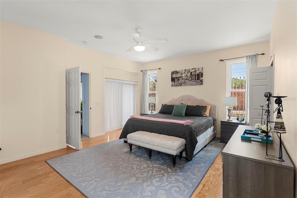 235 Hollinghead Loop Davenport, FL 33896 - Photo 16 of 30 a bedroom with a bed and a couch