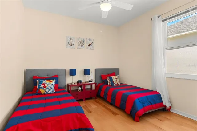 a bedroom with a bed and window