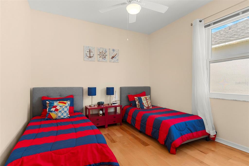 235 Hollinghead Loop Davenport, FL 33896 - Photo 22 of 30 a bedroom with a bed and window