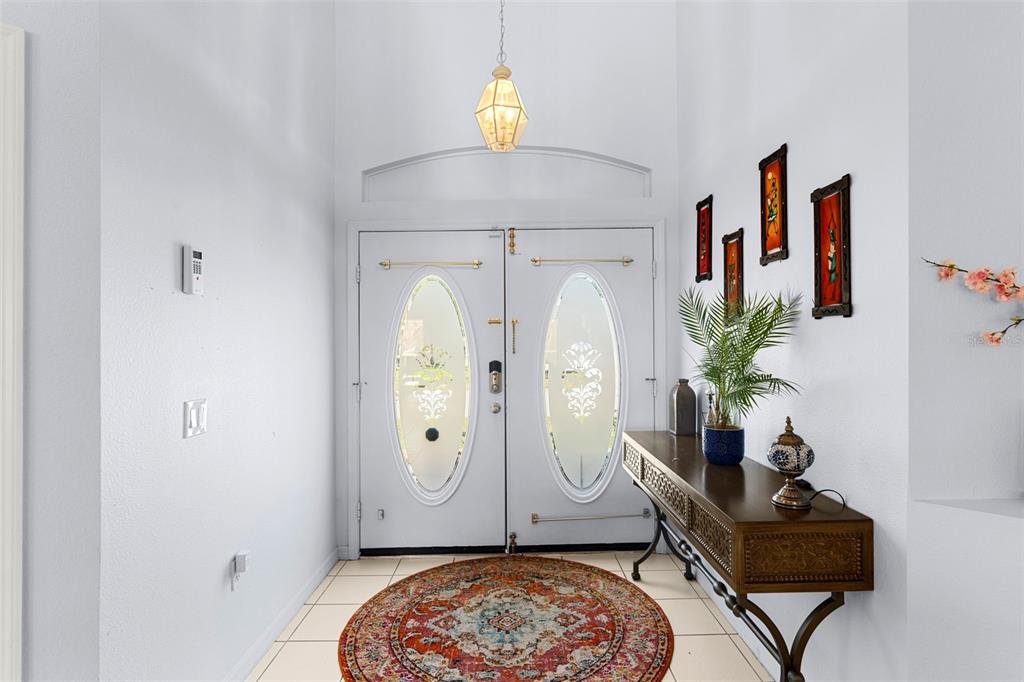 235 Hollinghead Loop Davenport, FL 33896 - Photo 4 of 30 a living room with furniture and a potted plant