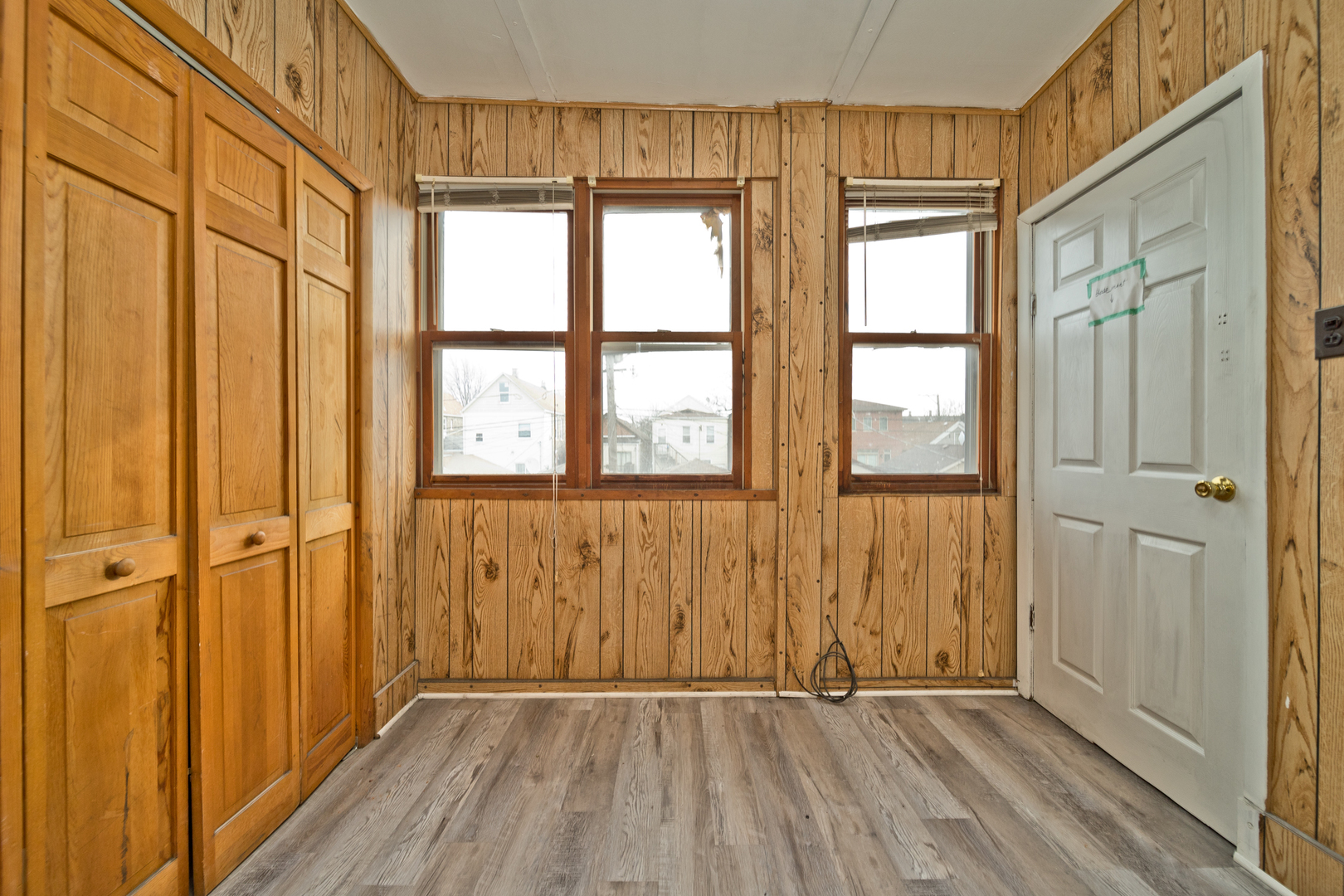 3641 South Union Avenue, Unit 2 Chicago, IL 60609 - Photo 11 of 13 wooden floor in an empty room with a window