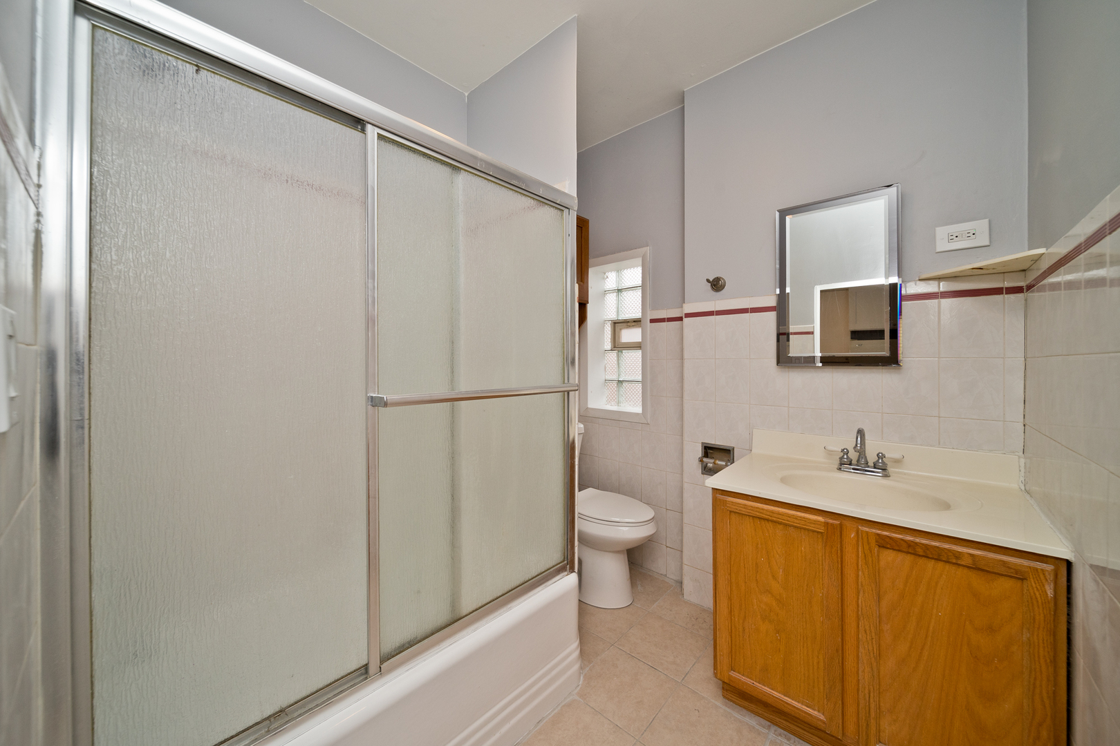 3641 South Union Avenue, Unit 2 Chicago, IL 60609 - Photo 10 of 13 a bathroom with a sink a toilet and mirror