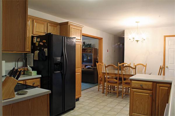 808 Orange Road Warwick, MA 01378 - Photo 20 of 30 a kitchen with a refrigerator and a sink